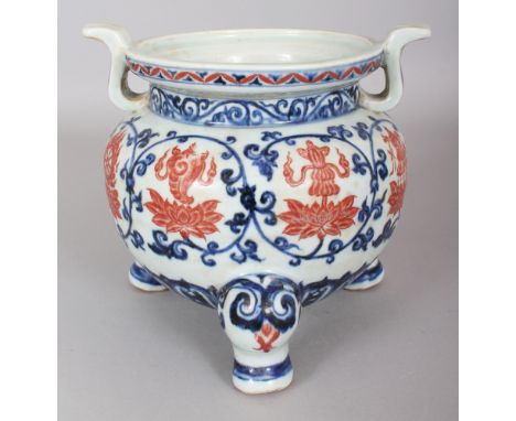 A CHINESE MING STYLE COPPER-RED &amp; UNDERGLAZE-BLUE PORCELAIN TRIPOD, decorated with Buddhist emblems above and within form