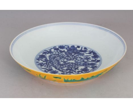 A CHINESE UNDERGLAZE-BLUE &amp; GREEN &amp; YELLOW ENAMELLED PORCELAIN DRAGON DISH, the base with a Jiaqing seal mark, 7in di