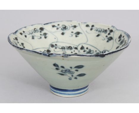 A CHINESE BLUE &amp; WHITE PROVINCIAL PORCELAIN BOWL, the base with a stylised seal mark, 5.7in diameter &amp; 2.75in high.