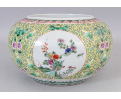 A CHINESE FAMILLE ROSE-VERTE YELLOW GROUND PORCELAIN JARDINIERE, decorated with floral roundels, the base with a six-characte