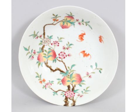 A CHINESE FAMILLE ROSE NINE PEACH PORCELAIN BOWL, the peach branches extending over the rim, the base with a Qianlong seal ma