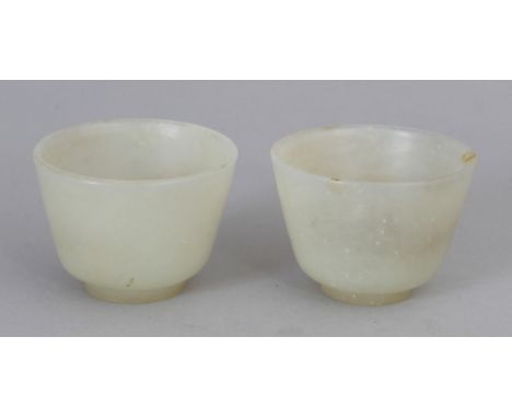 A PAIR OF CHINESE PALE CELADON JADE WINE CUPS, 2.2in diameter &amp; 1.6in high.