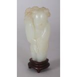 A SMALL 18TH/19TH CENTURY CHINESE CELADON JADE FIGURE OF A STANDING BOY, together with a fixed