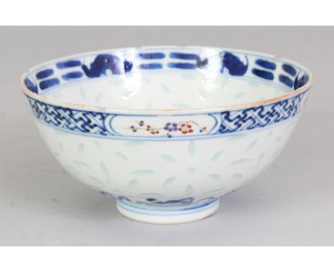 A 19TH CENTURY CHINESE BLUE &amp; WHITE &amp; ENAMEL DECORATED RICE PATTERN PORCELAIN BOWL, the interior painted to its centr