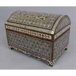 AN EARLY 20TH CENTURY ISLAMIC INLAID WOOD CASKET, with a domed and hinged cover, inlaid in mother-