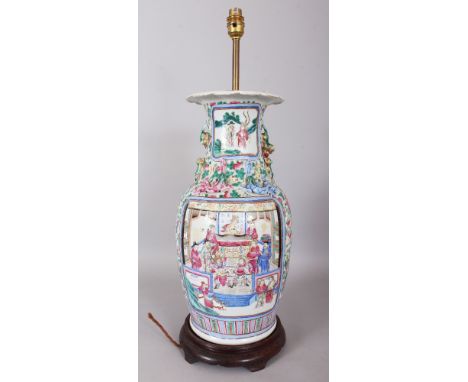 A LARGE 19TH CENTURY CHINESE CANTON FAMILLE ROSE PORCELAIN VASE, converted to a lamp with a wood stand, 16in high.