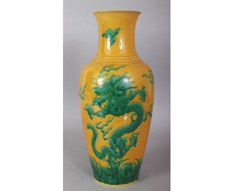 A CHINESE YELLOW &amp; GREEN ENAMELLED PORCELAIN DRAGON VASE, the base with a six-character Kangxi mark, 13.75in high.