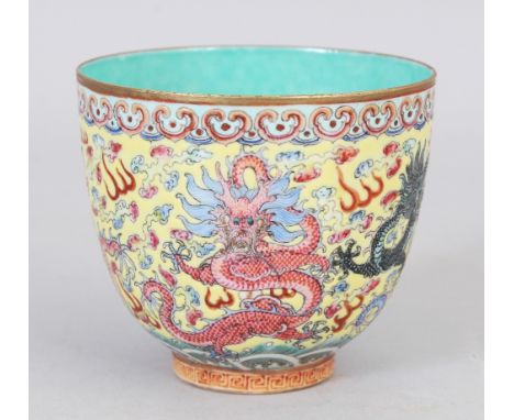A GOOD QUALITY CHINESE FAMILLE ROSE-VERTE YELLOW GROUND EGGSHELL PORCELAIN DRAGON CUP, the base with a four-character Qianlon