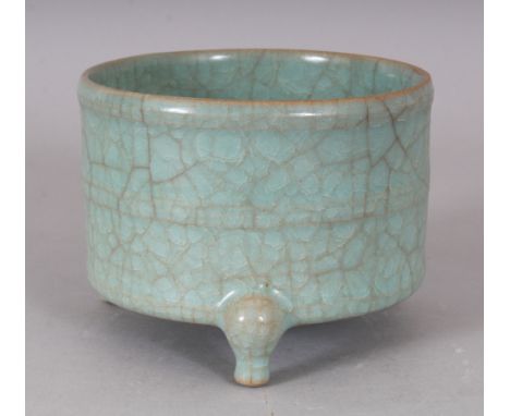 A CHINESE RU WARE PORCELAIN TRIPOD CENSER, applied with a crackled glaze, 4.7in diameter &amp; 5.5in high.