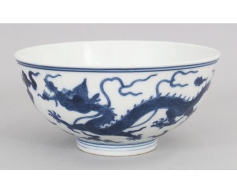 A GOOD QUALITY 20TH CENTURY CHINESE BLUE &amp; WHITE PORCELAIN DRAGON BOWL, the base with a Daoguang seal mark, 5.7in diamete