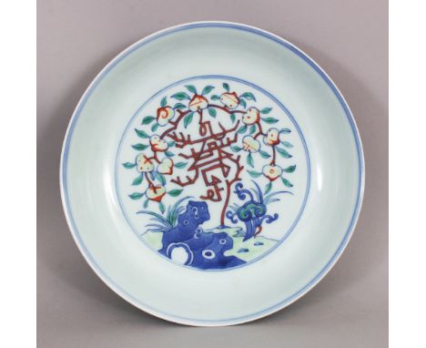 A CHINESE DOUCAI PORCELAIN SAUCER DISH, decorated with peach, lingzhi, ruyi, rockwork and auspicious characters, the base wit