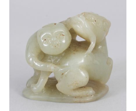 A CHINESE CELADON JADE MODEL OF A BOY &amp; A KYLIN, 1.75in high.