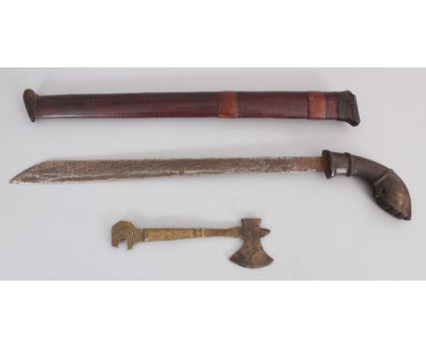 A Javanese Kris, Indonesia, 19th century, with crescent-shaped horn hilt, gently flared blade with triangular section, wood h