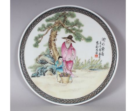 A CHINESE FAMILLE ROSE PORCELAIN PLATE, the interior decorated with a sage and his boy attendant, the base with a seal mark, 