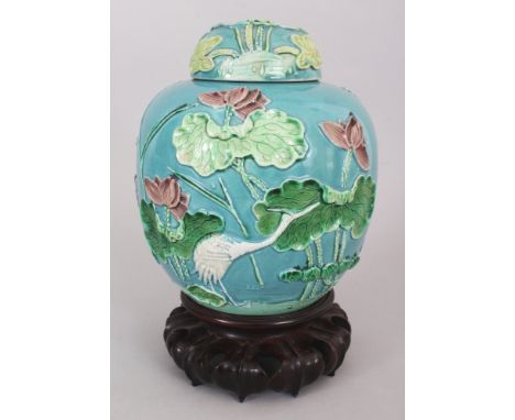 A CHINESE WANG BINRONG MOULDED PORCELAIN JAR &amp; COVER, together with a fitted carved hardwood stand, the sides decorated i