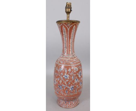 AN ISNIK STYLE CERAMIC VASE, converted to a lamp, decorated with scrolling foliage reserved on an ochre ground, 21in high ove