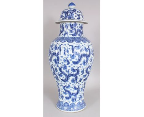 A GOOD LARGE CHINESE KANGXI PERIOD BLUE &amp; WHITE FLUTED PORCELAIN VASE &amp; COVER, circa 1700, painted with scrolling flo