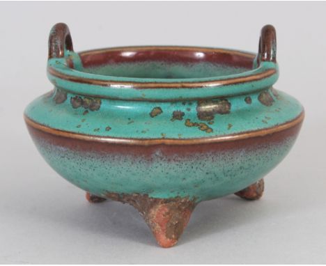 A CHINESE GREEN &amp; FLAMBE GLAZED TRIPOD PORCELAIN CENSER, 4in wide at widest point &amp; 2.8in high to top of handles.