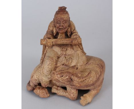 A 19TH/20TH CENTURY CHINESE BAMBOO CARVING OF A SCROLL BEARING SAGE, seated on the back of a water buffalo, 5.4in wide at wid