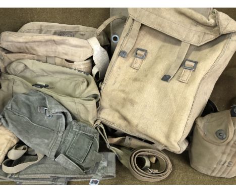 Sundry webbing including a US Army water bottle and a parachute pack