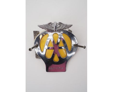 A vintage AA car bumper badge