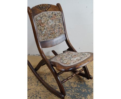 A reproduction folding rocking chair