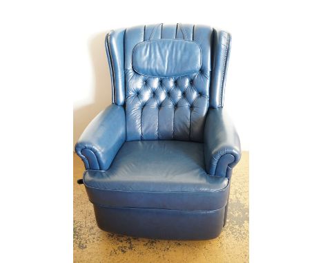 A blue leather recliner chair