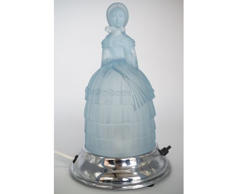 A mid 20th Century pressed blue glass figural table lamp, modelled as a young Victorian lady in crinoline dress and bonnet ho