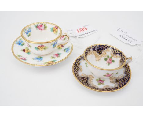 Two miniature cups and saucers 