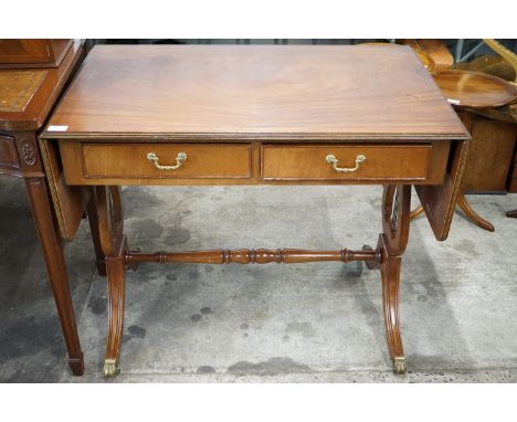 A reproduction Regency sofa table with lyre-form end standards