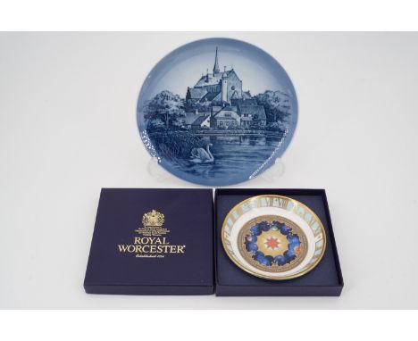 A Royal Copenhagen plate depicting the church of 'Haderslev Domkirke', 18.5 cm, and a boxed Royal Worcester 'Millennium' coas
