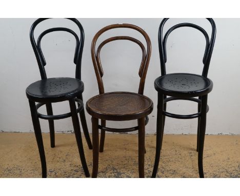 A pair of late 19th Century bentwood correction chairs, together with a Thonet bentwood cafe chair