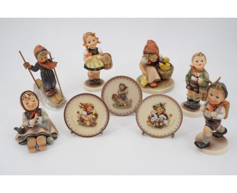 Five Hummel figurines including The Skier, School Boy, Feeding the Chicks, Boy and Girl with Baskets (both a/f) and one other