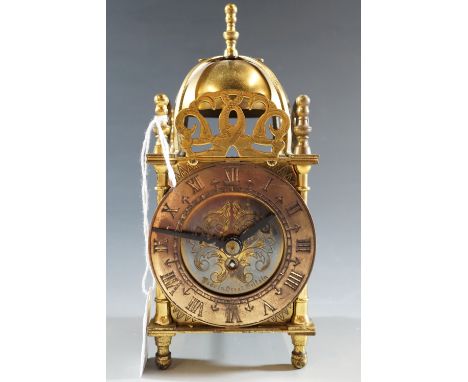 A brass lantern clock, 18 cm high