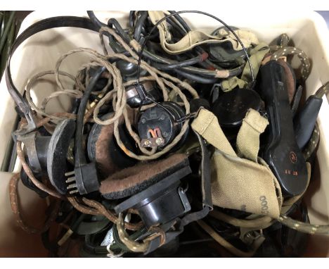 A large quantity of British army headphones etc 