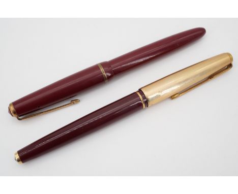 Vintage Parker "61" and "Duofold" fountain pens in maroon red