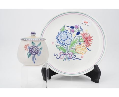 A Poole Pottery plate and preserve jar
