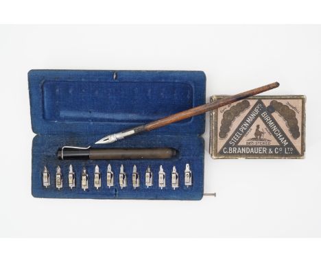 A vintage Pelican 'Graphos' cased calligraphy pen and assorted nibs, a dip pen, and a box of Brandauer nibs 