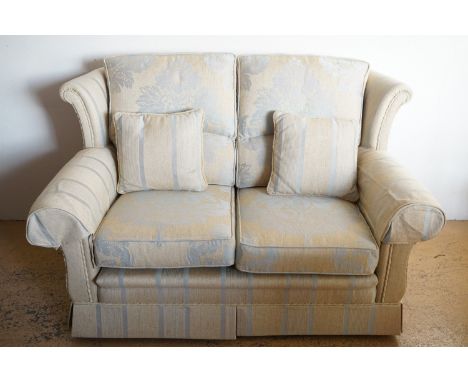 A three piece suite, two seater sofa and two chairs