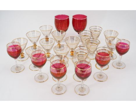 Eight ruby wine glasses and seventeen liqueur glasses