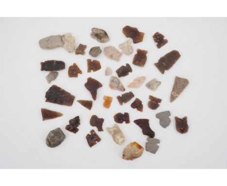 A quantity of antique Native American flint arrow heads etc