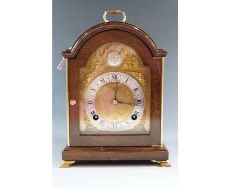 A mantle clock marked Tempus Fugit 