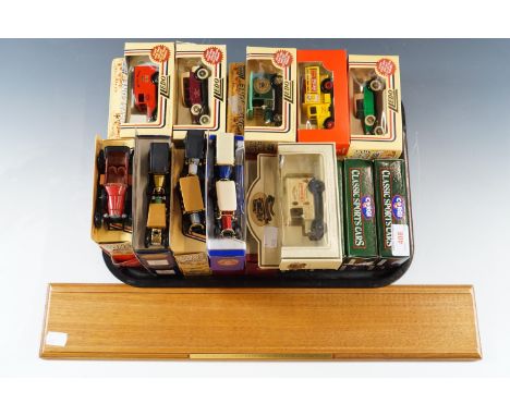 Eight boxed Corgi classic sports cars and display stand, together with boxed Lledo vintage cars etc