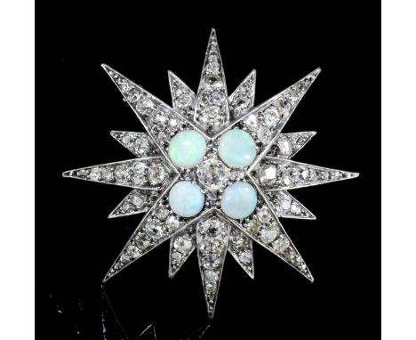 A Victorian silvery coloured metal mounted sixteen point diamond and opal star pattern brooch, the face set with four oval ca