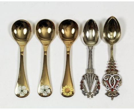 Eight Danish silver gilt and enamel fruit spoons, each with various enamel flowers to terminals and variously dated 1971, 197