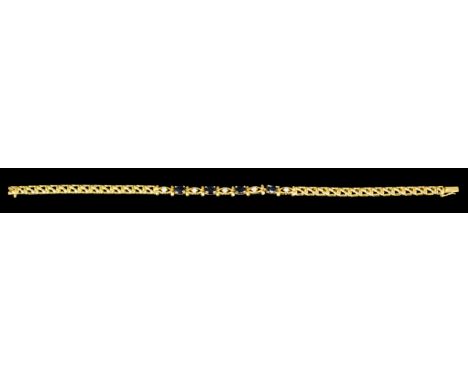 A modern 14k gold sapphire and diamond set bracelet, the face with four oval cut sapphires each approximately .20ct intersper