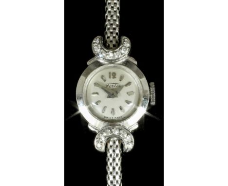 A 1960s lady's Fortis 18K white gold cased cocktail watch, the silvered dial with baton numerals, contained in plain case wit