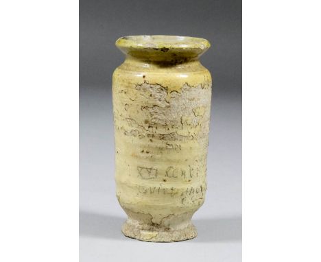 An English or Dutch olive green glazed pottery albarello, 4.5ins high (16th/17th Century - some degradation to glaze)