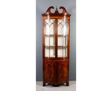 A modern mahogany bow-front corner cupboard of Georgian design by Arthur Brett & Sons, inlaid with stringings and crossbandin