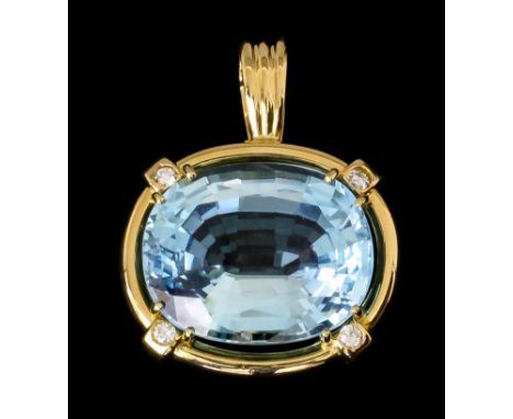 A modern gold coloured metal mounted blue topaz and diamond set pendant, the oval cut topaz 25mm x 20mm overall, contained in